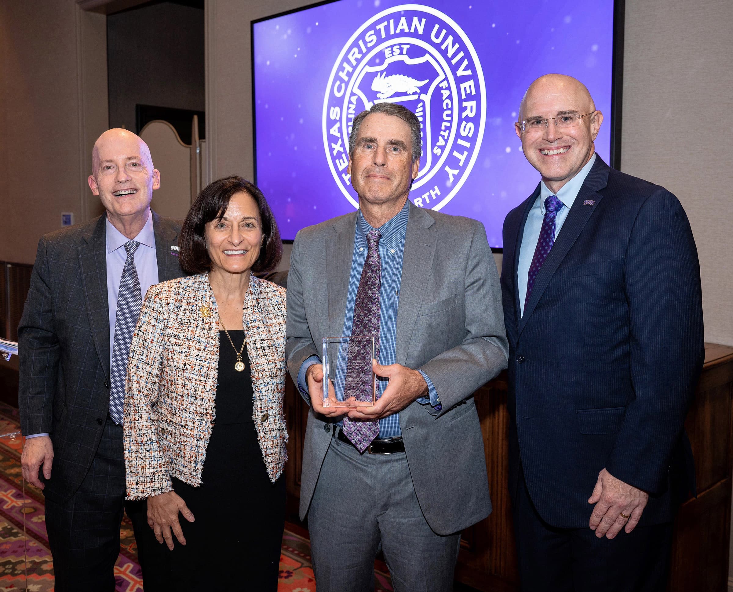 Dan Williams with Chancellor Boschini, Provost Dahlberg and Dean Pitcock accepting his award