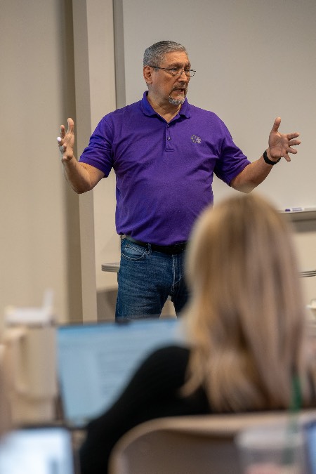 David Dena speaking to students in a classroom